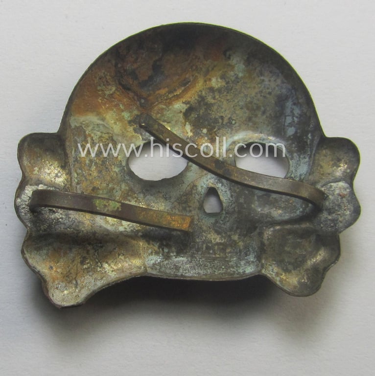 Very early-pattern, 'SS o. Allgemeine-SS' visor-cap skull (ie. 'Totenkopf für Kepi o. Schirmmütze') being a detailed- and/or non-maker-marked example as was executed in silver-coloured metal (ie. 'Buntmetall')