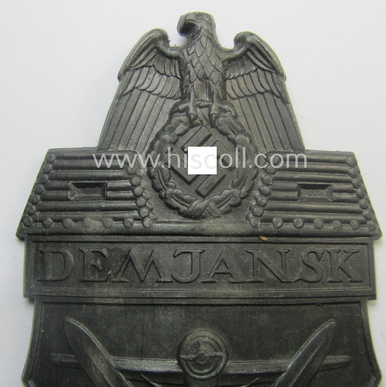 'Virtually mint' - albeit regrettably incomplete - example of a WH (Heeres ie. Waffen-SS) 'Demjansk'-campaign-shield as executed in typical non-magnetic, zinc (ie. 'Feinzink')