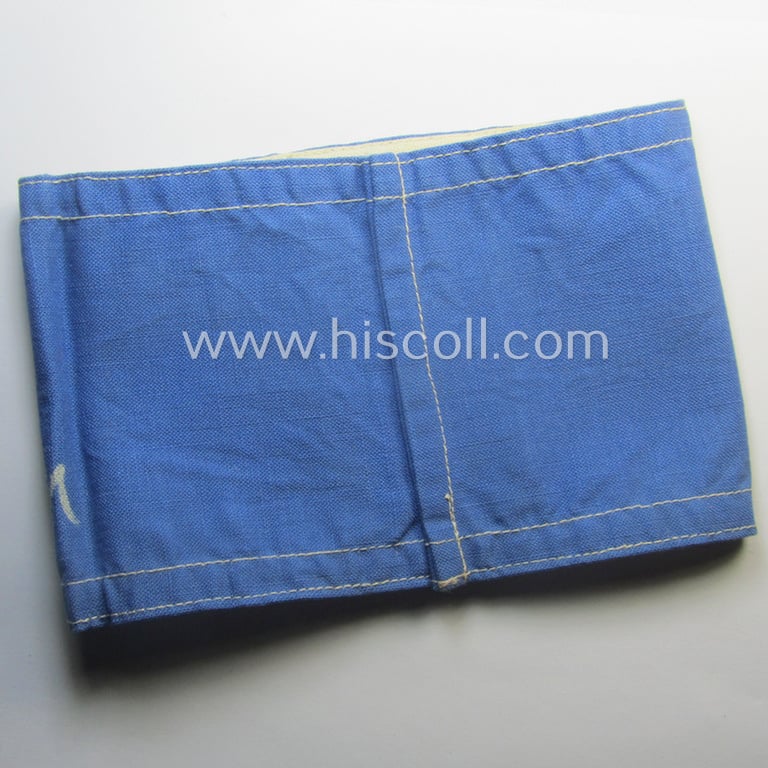 Unusually seen, linnen-based- and/or light-blue-coloured, DAF- (ie. KDF-) related armband (ie. 'Armbinde') showing white-linnen-toned borders and depicting the typical 'KDF'-logo and text: 'Stadtführer - N.S.G. Kraft durch Freude'