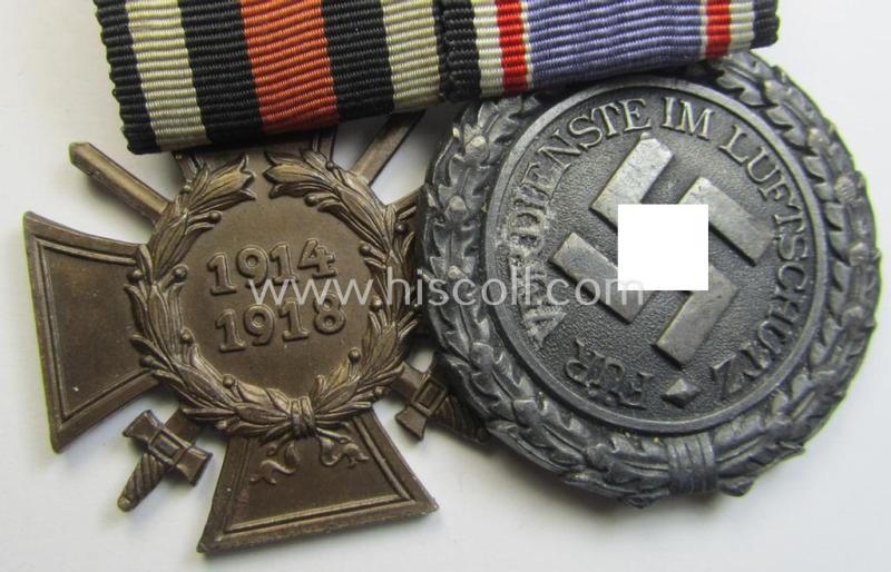 Unusually found, two-pieced (detachable!) medal-bar (ie. 'Doppelspange') respectively depicting a WWI-period: 'Frontkämpferkreuz 1914-18' (ie.: 'Kriegsteilnehmerkreuz mit Schw.') and a: 'Luftschutz-Ehrenzeichen 2. Stufe'