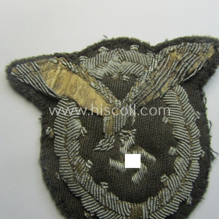 Partly damaged WH (Luftwaffe) 'Flugzeugführerabzeichen in Stoff' or: pilots'-badge) being a detailed, hand-embroidered example that comes in a truly worn- ie. carefully tunic-removed-, condition