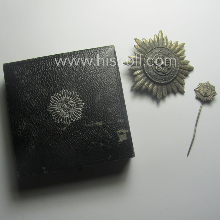 WH-related, so-called: 'Verdienstauszeichnung o. Steckkreuz für Angehörige der Ostvölker, 2. Kl. in Silber ohne Schwertern' being a (dual!) maker- (ie. '100' & 'L 55'-) marked example that comes stored in its accompanying, period-etui