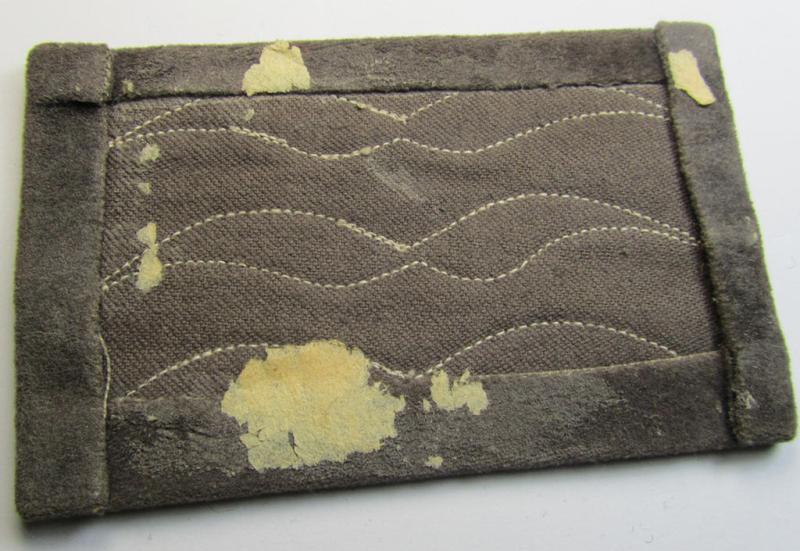 Single - but nevertheless scarcely found! - WH (LW) light-blue-coloured- and/or woolen-based, NCO-type rank-patch (aka 'moustache') as was specifically intended for usage by a non-commissioned officer holding the rank of: 'Feldwebel' (ie. sergean...