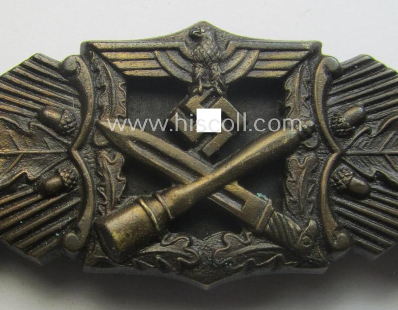'Nahkampfspange in Bronze' (or: bronze-class close-combat clasp ie. CCC) being a neatly maker-marked- and/or minimally converse-shaped specimen as was produced by the: 'JFS'- (ie. 'Joseph Feix u. Söhne'-) company