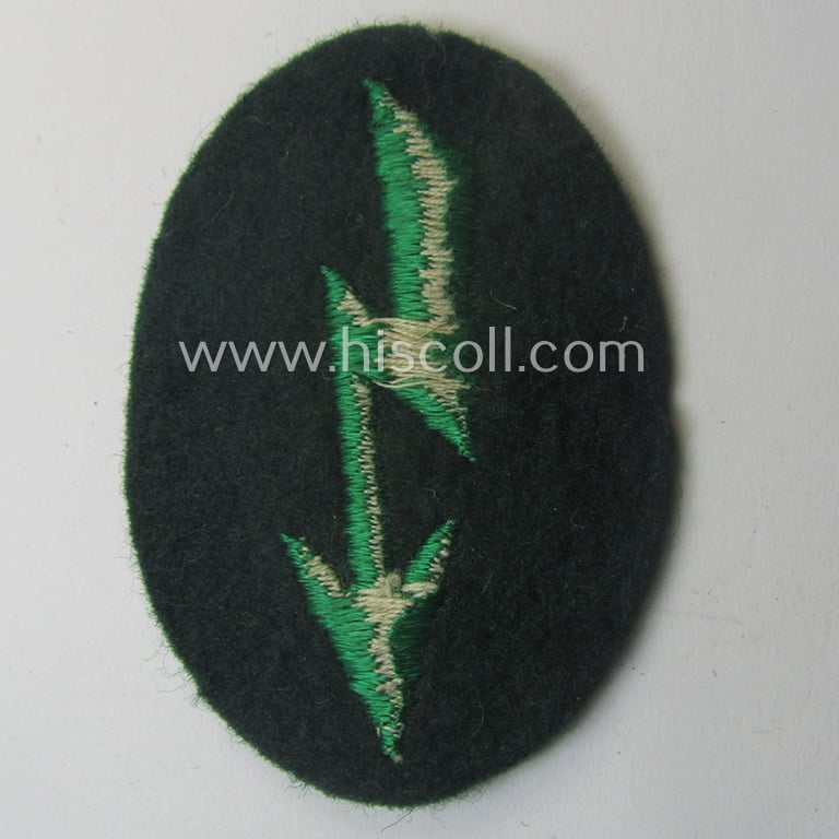 WH (Heeres) trade- and/or special-career-insignia ie. machine-embroidered 'signal-blitz' being a non-maker-marked example as executed in green-coloured linnen as was specifically intended for a soldier within the: 'Jäger- o. Geb.Jäger-Trpn.'