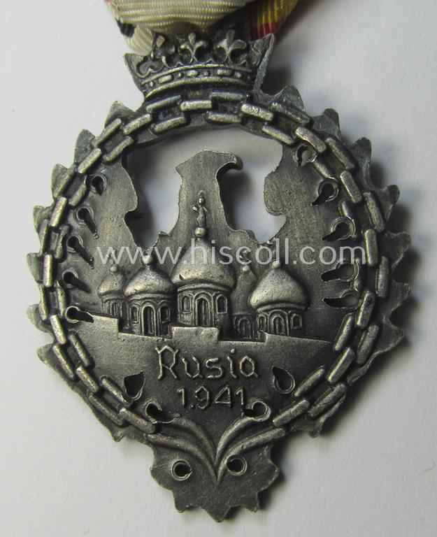Attractive example of a Spanish-issued, campaign-medal of the Spanish Blue Division in Russia called: 'Medalla Conmemorativa Division Azul - Medalla de Tropa 1941' that comes mounted on its (typically Spanish) mounted ribbon as issued and/or worn