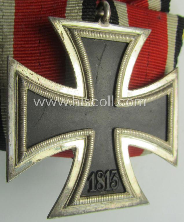 Superb, Iron Cross 2nd class (or: 'Eisernes Kreuz 2. Klasse') being a nicely preserved, maker- (ie. '100'-) marked example by the maker (ie. 'Hersteller'): 'Wächtler & Lange' and that comes period-mounted as a so-called: 'Einzelspange'