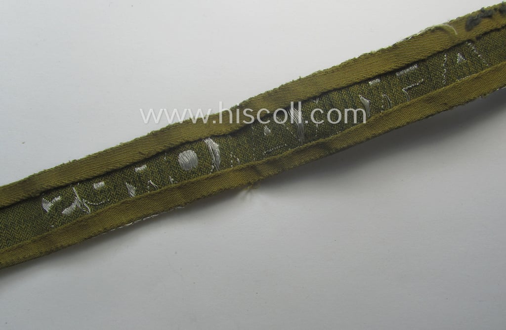 Truly worn, 'BeVo'-like cuff-title (ie. 'Ärmelstreifen') entitled: 'Afrikakorps' being a with certainty issued example that comes in an overall very nice- (ie. non-shortened- and/or once tunic-attached-), condition