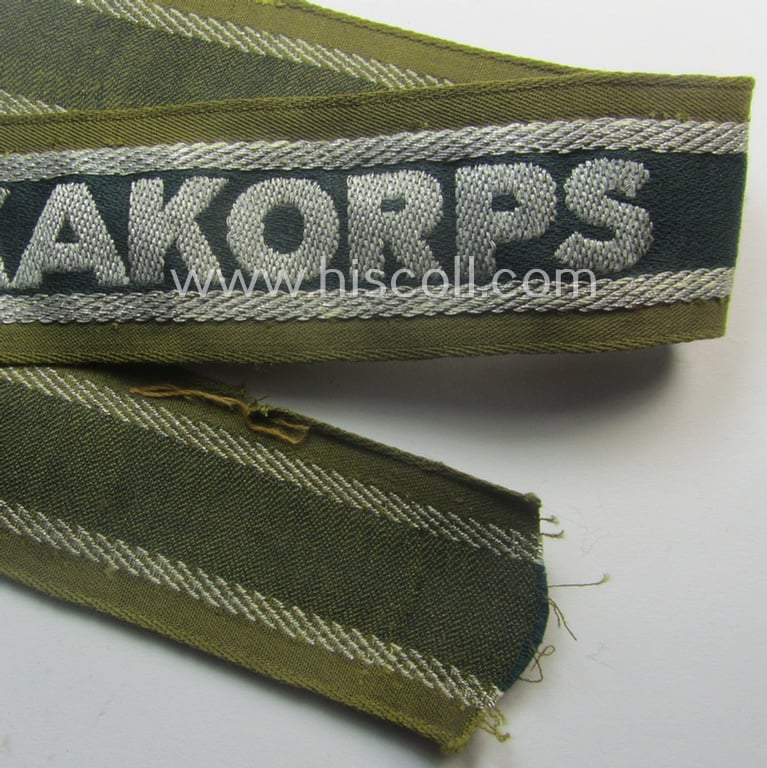 Truly worn, 'BeVo'-like cuff-title (ie. 'Ärmelstreifen') entitled: 'Afrikakorps' being a with certainty issued example that comes in an overall nice- (ie. hardly shortened- and/or once tunic-attached-), condition