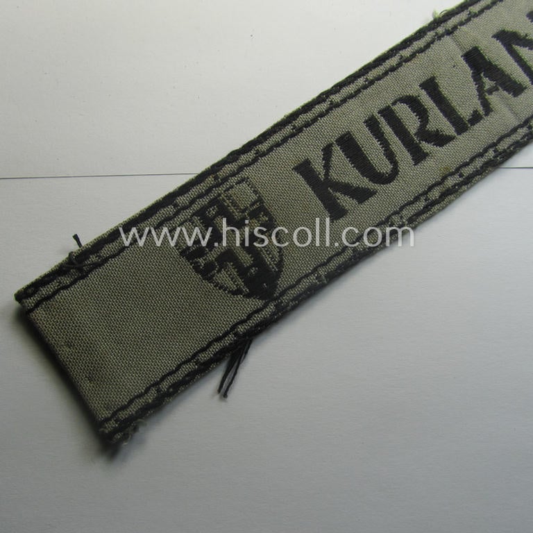 WH (Heeres ie. Kriegsmarine) cuff-title- ie. armband (ie. 'Ärmelstreifen') entitled: 'Kurland' that comes in an overall very nice- (albeit clearly used- ie. tunic-removed-), condition