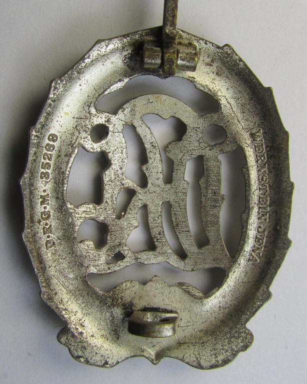 Attractive, 'Reichssportabzeichen DRL in Silber' (or: silver-class DRL sports'-badge) being a typical zinc- (ie. 'Feinzink'-) based example that is nicely maker- (ie. 'Wernstein - Jena'-) marked on its back