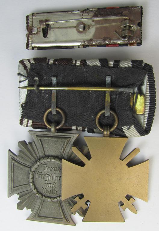 Superb, 2-pieced N.S.D.A.P.-related medal-bar (ie. 'Ordenspange') showing resp. an: a: 'FKK 1914-18 mit Schwn.' and a: 'N.S.D.A.P.-Dienstausz. in Bronze' (ie. '3. St. für 10 Jahre t. D.') that both come mounted as a (detachable!) 'Doppelspan...