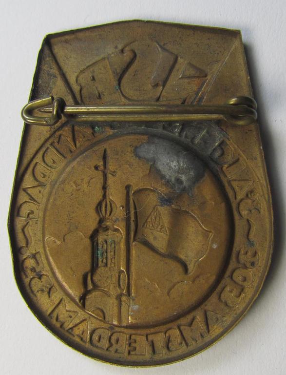 Dutch NSB-party-related: 'Landdag'-lapel-pin (ie. 'Veranstaltungsabzeichen' ie. tinnie) that is executed in golden-toned- (ie. copper-based-) metal and that is depicting the text: 'NSB - Algemene Landdag - Amsterdam - 30.3.35'