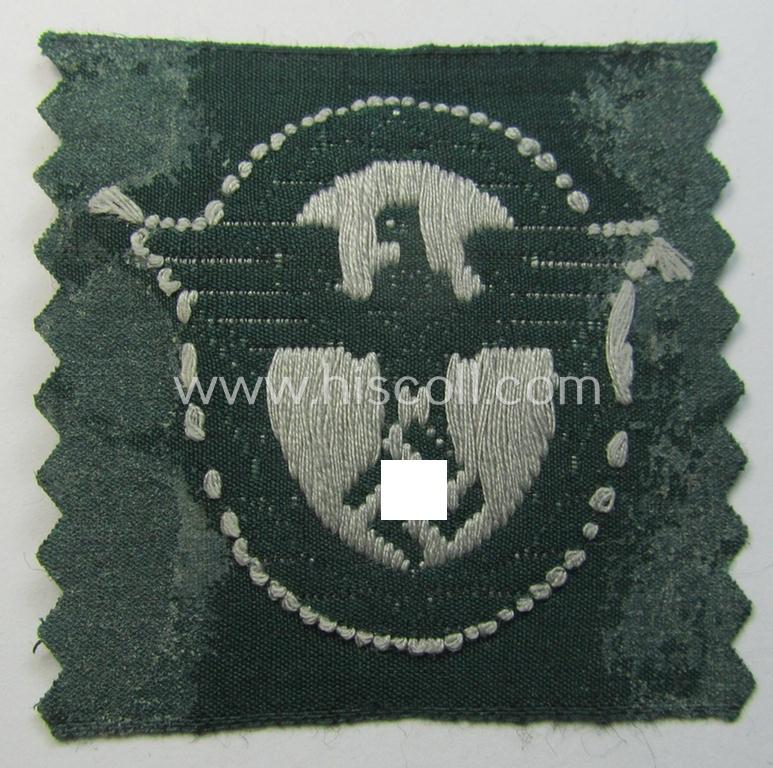 Attractive, EM/NCO-pattern, police- (ie. 'Polizei-') related cap-eagle (ie. 'Adler für Schiffchen o. Einheitsfeldmütze') being a 'virtually mint- ie. unissued' example as executed in 'BeVo'-weave-style onto a green-coloured background