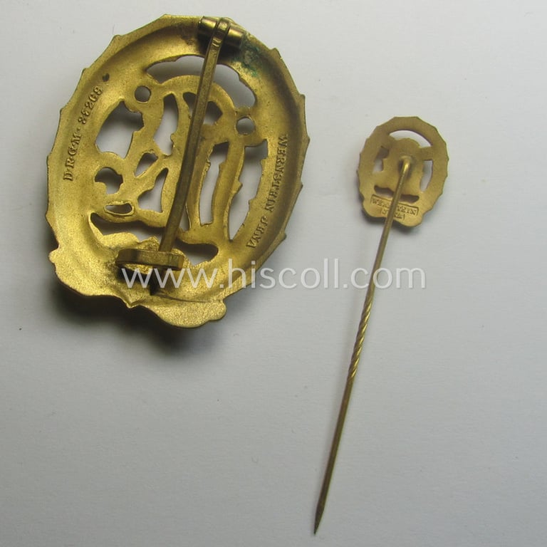 Superb, 'Reichssportabzeichen DRL in Gold' (or: golden-class DRL sports'-badge) being a maker- (ie. 'Wernstein - Jena'-) marked example and that comes with its accompanying miniature