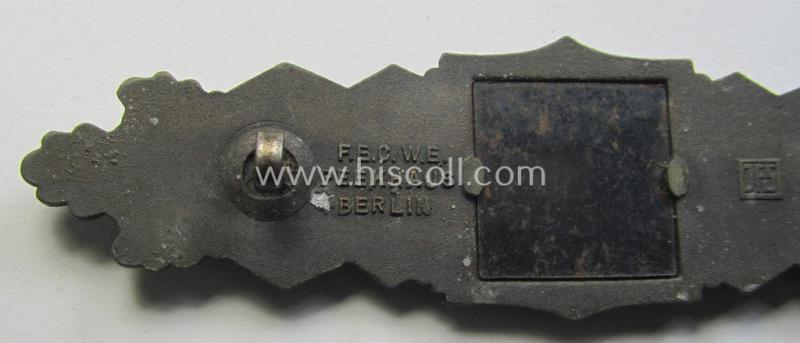 Superb, 'Nahkampfspange in Bronze' (or: bronze-class close-combat clasp ie. CCC) being a neatly maker-marked- and/or minimally converse-shaped specimen as was produced by the: 'JFS'- (ie. 'Joseph Feix u. Söhne'-) company