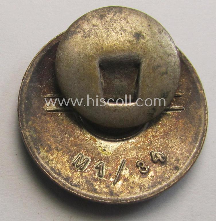 Attractive - bright-red-coloured and nicely preserved! - 'N.S.D.A.P.'-membership-pin- ie. party-badge (or: 'Parteiabzeichen') which is maker-marked on its back with the makers'-designation: 'RzM' and/or: 'M1/34'