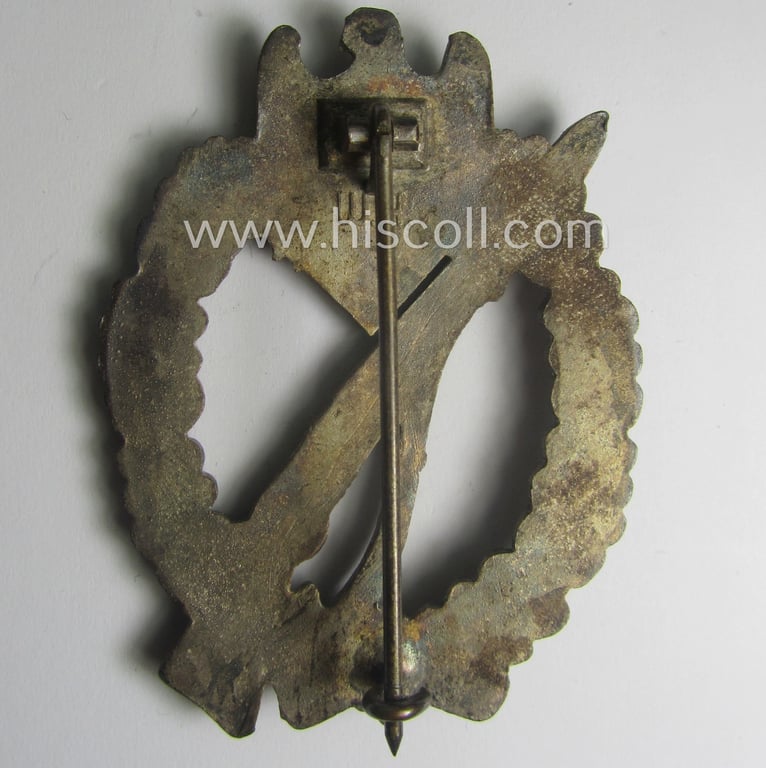 'Infanterie Sturmabzeichen in Silber' being a maker- (ie. 'W.H.'-) marked and/or quite converse, 'solid-back' example by the Austrian-based maker: 'Wilhelm Hobacher' as was executed in bright silver-coloured, zinc-based metal