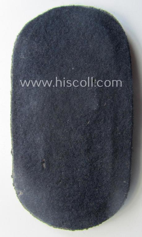 WH (Kriegsmarine) 'Narvik'-campaign-shield being a detailed example as executed in (light) golden-toned zinc- (ie. 'Feinzink') and that comes in an issued- (and/or moderately worn- ie. once tunic-attached-), condition