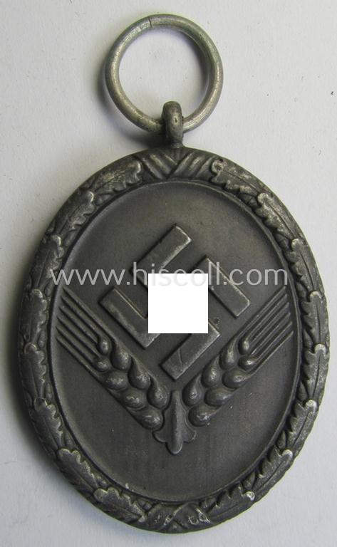 Attractive example of a: 'Reichsarbeitsdienst der weiblichen Jugend' (or: RADwJ) so-called: 'Dienstauszeichnung 3. Stf. in Silber' that comes mounted onto its period (broad-sized) ribbon (ie. 'Bandabschnitt')