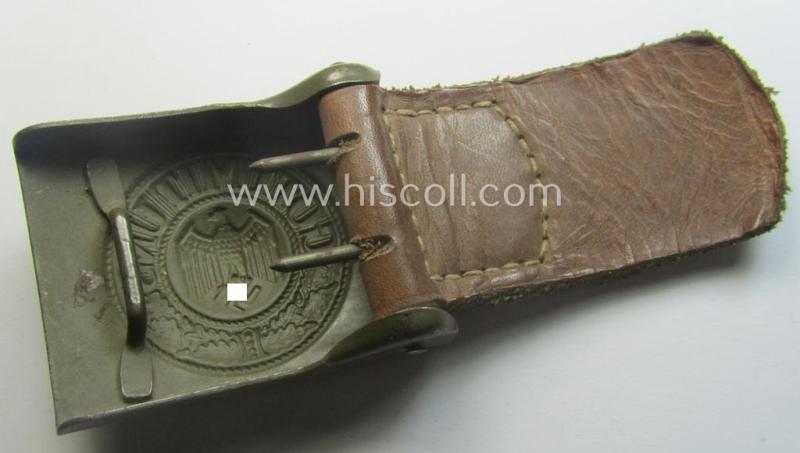 Minimally used, WH (Heeres) field-grey-coloured- and/or steel-based belt-buckle being a (typical) non-maker-marked example that comes mounted onto its maker- (ie. 'C.W. Motz'-) marked and/or '1941'-dated leather-based tab