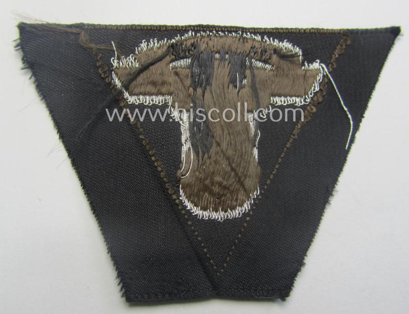 Never used - ie. 'virtually mint'! - so-called: N.S.K.K. (ie. 'National Soc. Kraftfahr Korps') side-cap-eagle (ie. 'Adler für Schiffchenmütze') being a 'flat-wire-woven'-example that comes mounted onto a darker-brown-coloured background