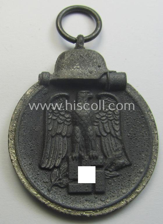 Neatly maker- (ie. '19'-) marked medal: 'Winterschlacht im Osten 1941/42' that came stored in its period pouch by the company: 'E. Ferd. Wiedmann'