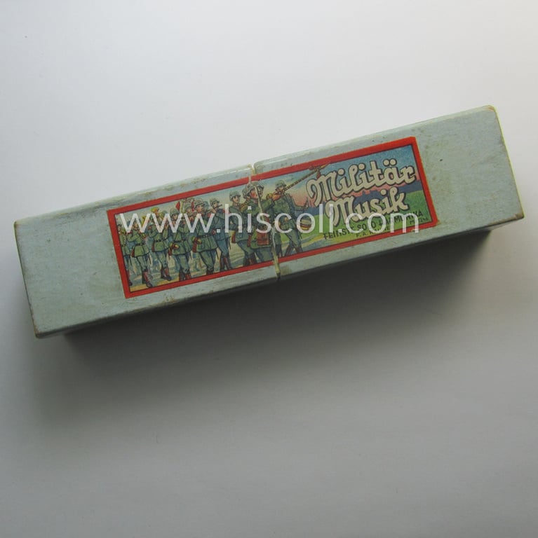 Superb - and still 'virtually mint ie. unissued'! - TR-era- (ie. 'Deutsche Wehrmacht'-) related harmonica entitled: 'Miltär Musik' that came stored in its original and/or carton-based box ie. etui
