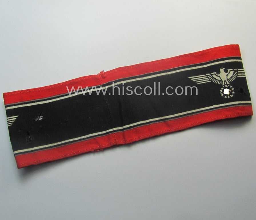 Moderately worn example of a (typically printed- and/or later-war-period) bright-red- and/or black-coloured so-called: 'Deutscher Volkssturm'-armband (ie. 'Armbinde') that comes in an overall nice condition