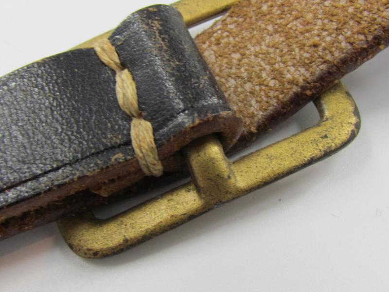 Leather shoulder strap marked DRGM