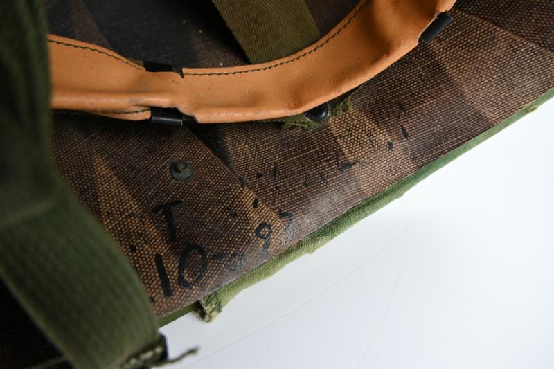 US Vietnam War Infantry helmet with camouflage cover and attached content