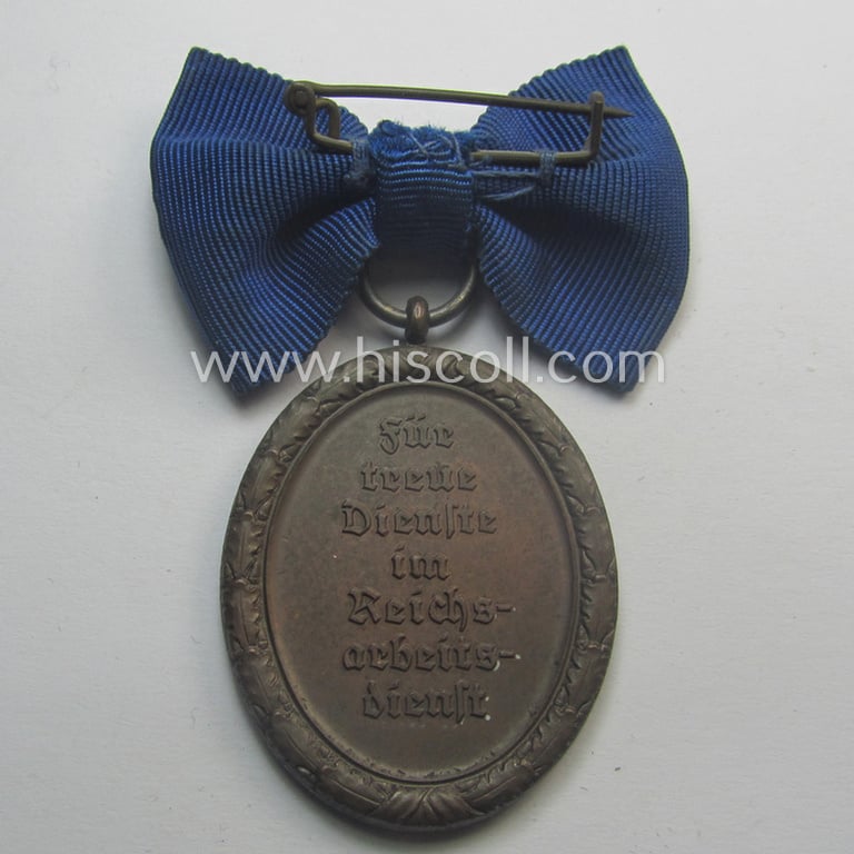 Scarcely encountered example of a: 'Reichsarbeitsdienst der weiblichen Jugend' (or: RADwJ) so-called: 'Dienstauszeichnung der 4. Stf. in Bronze' that comes mounted onto its period ('bow-tie'-shaped) ribbon (ie. 'Bandabschnitt')
