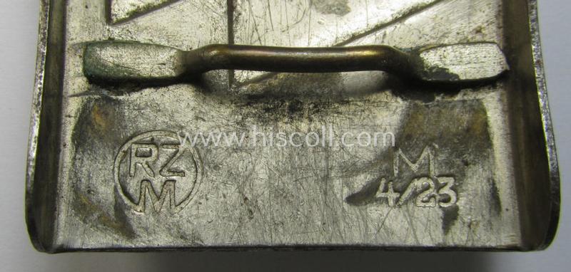 Attractive, DJ (ie. 'Deutsches Jungvolk') silver-coloured- (ie. typical nickle-chromed) belt-buckle (ie. 'Koppelschloss') being a clearly maker- (ie. 'RzM M4/23'-) marked example that comes in a moderately used- ie. worn, condition