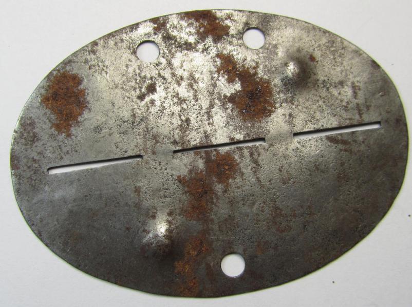 Attractive, steel-based-, WH (Heeres-) ie. 'Panzer-Grenadiere o. Infanterie'-related ID-disc bearing the clearly stamped unit-designation: 'Stamm.Komp.Pz.Gren.Ers.Batl. 215' and that comes as issued- and/or recently found