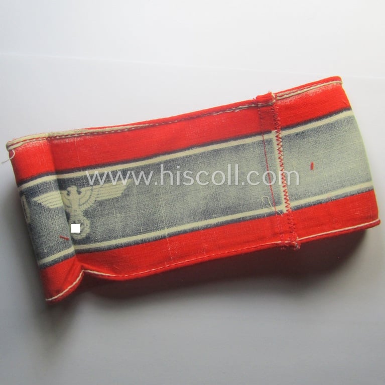 Typically printed- and/or later-war-period, bright-red- and/or black-coloured so-called: 'Deutscher Volkssturm'-armband (ie. 'Armbinde') that comes in an overall very nice- (I deem hardly used- nor worn- ie. 'virtually mint'-), condition