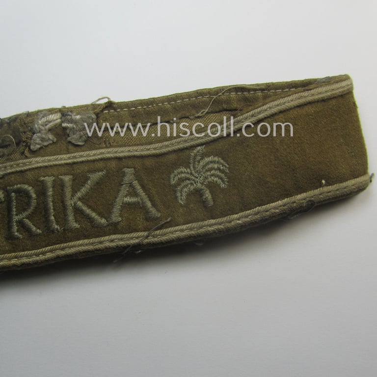 Cleary worn, WH cuff-title (ie. 'Ärmelstreifen') entitled: 'Afrika' (that bears a printed 'RbN.'-numeral!) being a minimally shortened example that comes in an overall very nice- (ie. issued and clearly worn ie. once tunic-attached-), condition
