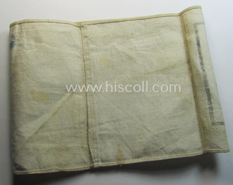 Neat, beige/white-coloured- and/or linnen-based armband (ie. 'Armbinde') as was executed in the 'thicker-styled' fabric as was intended for WH (Heeres) staff-members working as: 'Hilfs-Krankenträger'