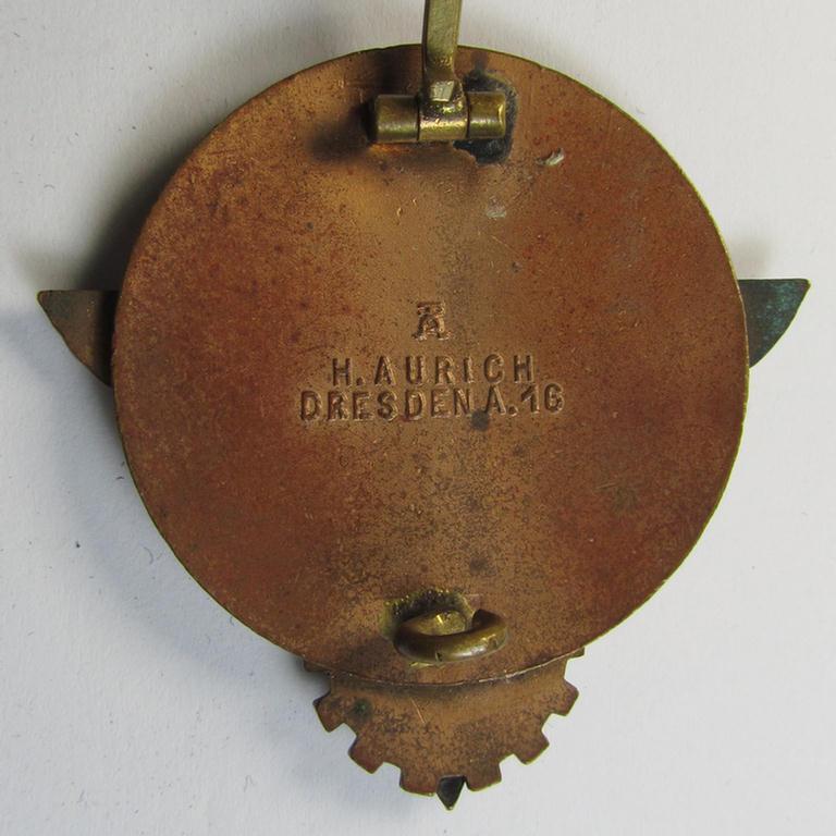 Clearly worn 'HJ'- ('Hitlerjugend') ie. 'BDM'- ('Bund Deutscher Mädel') related: 'Reichsberufswettkampf-Siegerabzeichen' (of the 2nd model) entitled: 'Kreissieger 1939' and being a neatly maker- (ie.: 'Hermann Aurich'-) marked example