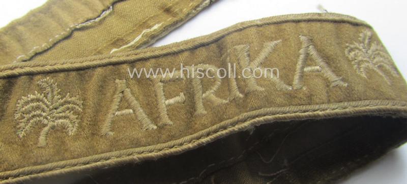 WH cuff-title (ie. 'Ärmelstreifen') entitled: 'Afrika' (being a minimally shortened example that comes in an overall very nice- (ie. issued and clearly worn ie. once tunic-attached-), condition