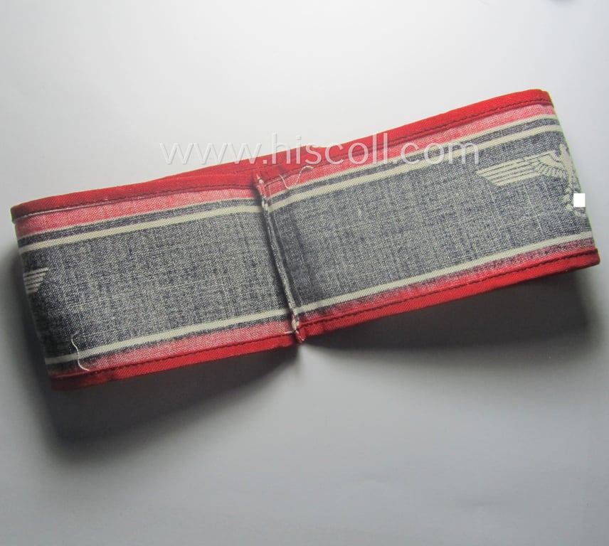 Typically printed- and/or later-war-period, bright-red- and/or black-coloured so-called: 'Deutscher Volkssturm'-armband (ie. 'Armbinde') that comes in an overall very nice- (I deem hardly used- nor worn- ie. 'virtually mint'-), condition