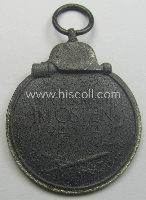 Neatly maker- (ie. '19'-) marked medal: 'Winterschlacht im Osten 1941/42' that came stored in its period pouch by the company: 'E. Ferd. Wiedmann'