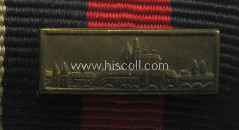 Neat, two-pieced WH (Heeres etc.) ribbon-bar (ie. 'Band- o. Feldspange') that is showing the ribbons for both an Austrian- and Czech 'Anschluss'-medal (and having a detailed miniature 'Prager Burg-Spange' period-attached)