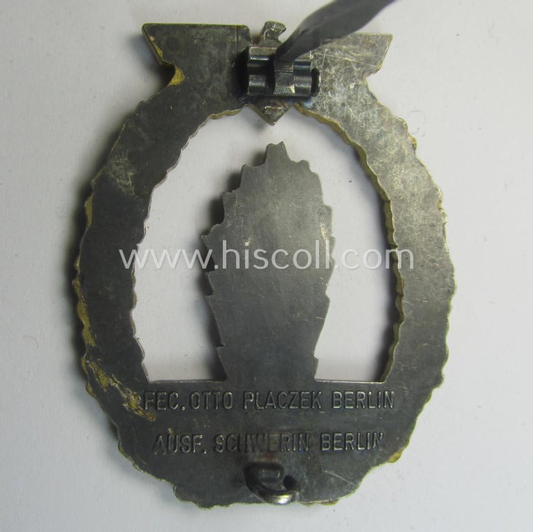 WH (Kriegsmarine) 'Kriegsabzeichen für Minensuch-, U-Boot-Jagd und Sicherungs-Verbände' (being a very detailed and clearly maker-marked example as executed in multi-coloured 'Buntmetall' as produced by the: 'Schwerin - Berlin'-company)