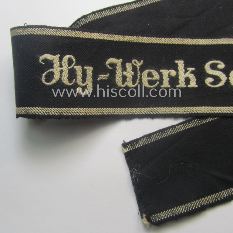 Never before seen - full length and with certainty very scarcely encountered! - neatly 'BeVo'-woven 'Ärmelstreifen' (ie. cuff-title) as was intended for the various (I deem merely civil) staffmembers serving within the: 'HY-Werk Scholven'
