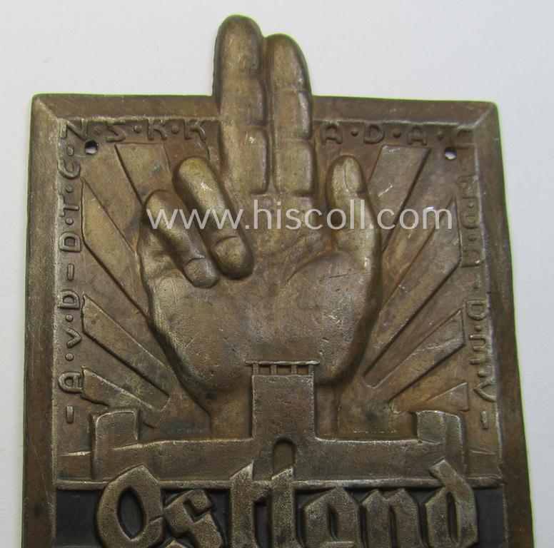 Unusual, commemorative 'N.S.K.K.- o. A.D.A.C.'-related car-plaque (ie. 'Erinnerungs- o. nichttragbare Kraftwagenplakette') showing a upright-positioned hand, swastika and text: 'Ostland Treuefahrt 1933'