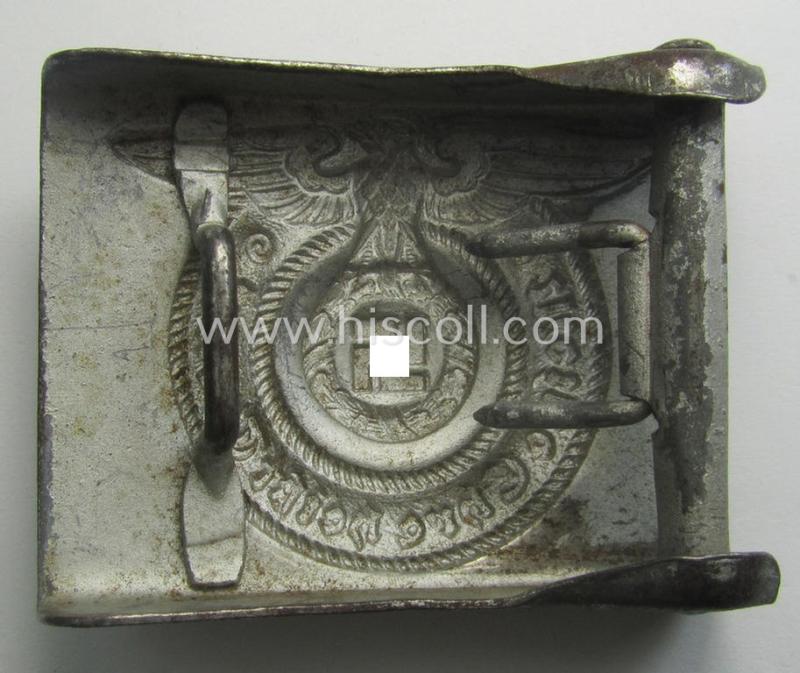 Waffen-SS, EM- (ie. NCO-) type belt-buckle (being a typical, unmarked and typical steel-based: 'Overhoff & Cie'-example) that comes in a surely issued- and/or moderately used- ie. worn, condition