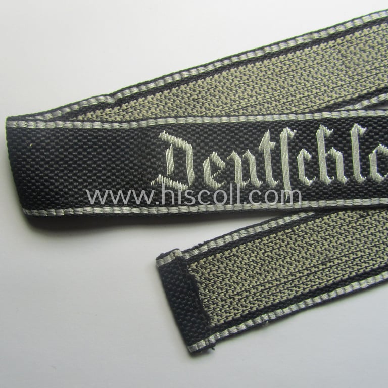 Stunning, Waffen-SS officers'-type, 1939/40-pattern cuff-title (ie. 'Ärmelstreifen') as executed in flat-wire 'BeVo'-weave-pattern (in Gothic-styled script!) for an officer within the: SS-Rgt. 'Deutschland' (2. SS-Pz-Div. "Das Reich")