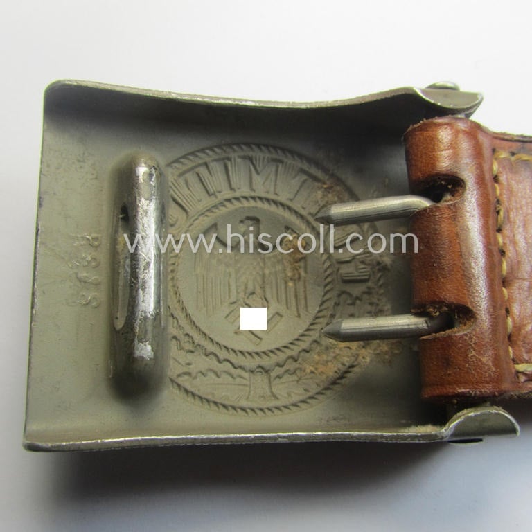 WH (Heeres) 'standard-pattern', field-grey-toned- and aluminium-based belt-buckle being a maker- (ie. 'R. Sieper & Söhne'-) marked- and/or: '1938'-dated example that comes mounted onto its leather-based tab