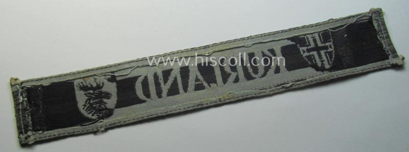 Full-length example of a WH (Heeres ie. Kriegsmarine) cuff-title- ie. armband (ie. 'Ärmelstreifen') entitled: 'Kurland' that comes in an overall very nice- (albeit clearly used- ie. tunic-removed-), condition