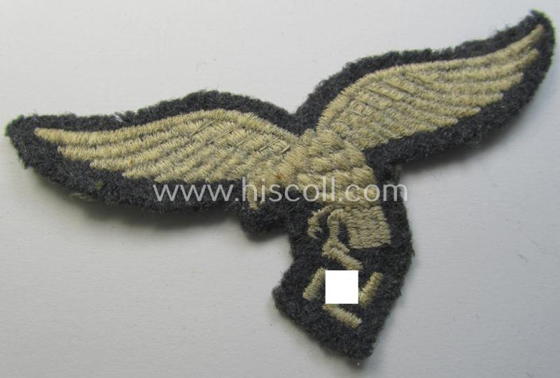 WH (Luftwaffe) enlisted-mens'- (ie NCO-) pattern, machine-embroidered breast-eagle (showing a 'down-tailed'-eagle and being an early- ie. pre-war-period example) that comes in a moderately used- ie. once tunic-attached, condition